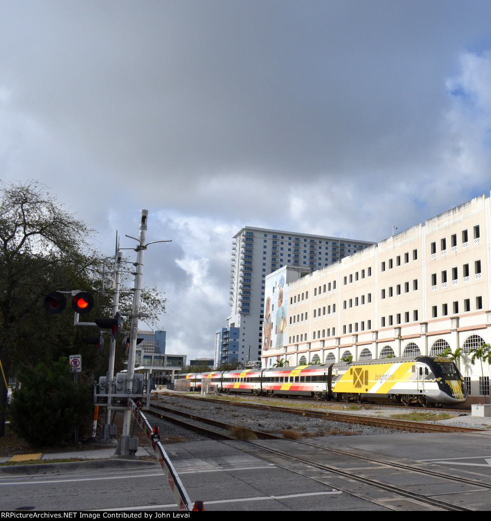 Northbound Brightline Train about to cross Fern Street in Downtown WPB 